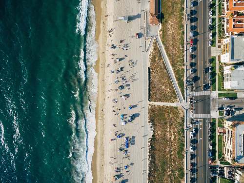 drone view aerial photography of people near sea at daytime california